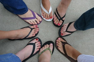 different painted toes pointing towards each other in a circle